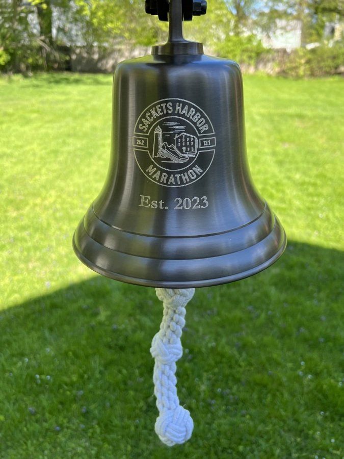 The engraved Sackets Harbor Marathon bell, est. 2023