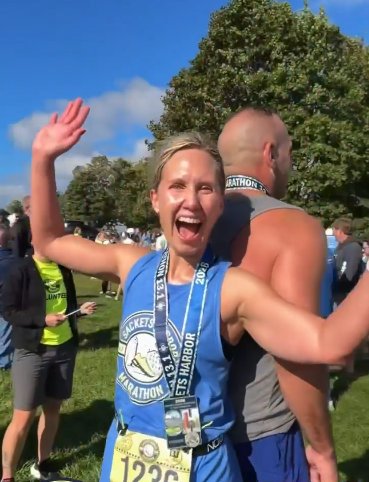 A finisher celebrating in the 360° photo booth